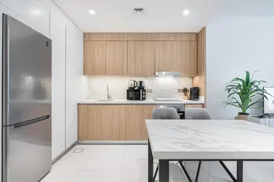 a kitchen and dining room with a table and chairs at Stunning Beachfront Home with Panoramic Sea Views in Dubai