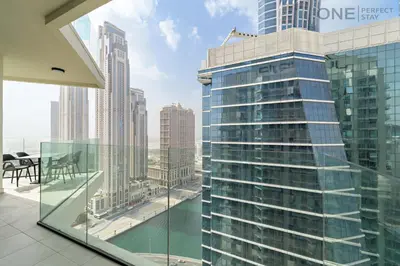 a view from the balcony of a tall building at Stylish 2BR in Business Bay canal View Pool & Gym in Dubai