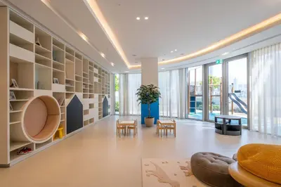 a large living room with a couch and chairs at GuestReady - Burj Khalifa View l Infinity Pool in Dubai