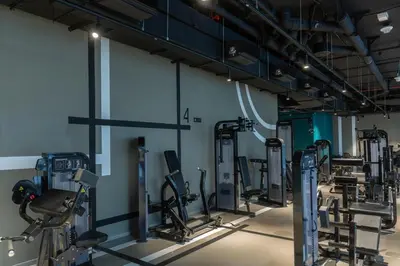 a gym with treadmills and elliptical machines at Burj & Beyond - Luxury Stay with Burj Khalifa View in Dubai