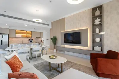 a living room with a couch and a table at Seaview Living 2 Bedroom - Grand Bleu by Elie Saab in Dubai