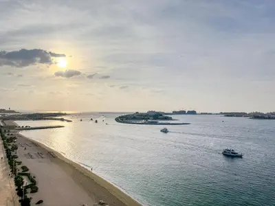 a view of a beach with boats in the water at Seaview Living 2 Bedroom - Grand Bleu by Elie Saab in Dubai