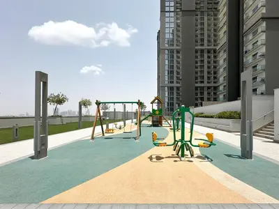 a playground on the roof of a building at Trophy - Elegant Cozy 1Bdr in Sobha Hartland in Dubai