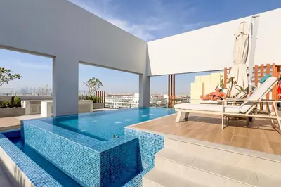 a swimming pool on the roof of a building at GuestReady - Glamorous retreat in JVC in Dubai
