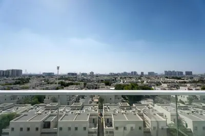 a view of the city from the balcony at Vacay Lettings - Pearlz By Danube -Studio-Al Furjan-Near Metro in Dubai