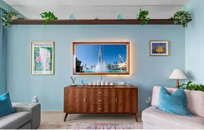 a living room with a couch and a table at Front Row Burj Khalifa Views - Dubai Mall Access - Premium 2BDR in Dubai
