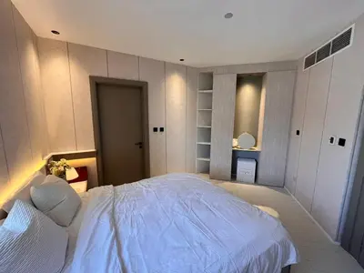a bedroom with a large white bed in it at Dubai Gate 1 in Dubai
