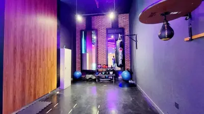 a hallway with a room with a table and a mirror at Studio apartment in jumeriah village triangle district 2 in Dubai