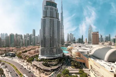 a large skyscraper in a large city with buildings at Modern Stylish 2 Bedroom Apartment with Burj Khalifa View in Dubai