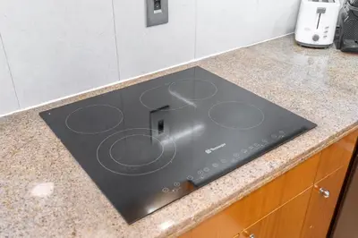 a stove top on a counter in a kitchen at Premium 2 Bedroom in Trident Residence JBR in Dubai