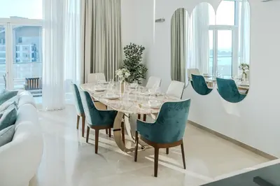 a dining room with a table and chairs at Clever Guest 028 Baltic in Dubai