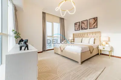 a bedroom with a bed and a large window at Stunning 2BR with Assistant Room in MAG 214, Jumeirah Lake Towers by Deluxe Holiday Homes in Dubai
