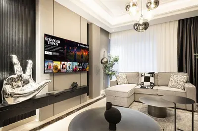 a living room with a couch and a table at 3BR Luxury Escape at Mon Reve I Access to Pool and Gym in Dubai