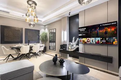 a living room with a table and a dining room at 3BR Luxury Escape at Mon Reve I Access to Pool and Gym in Dubai