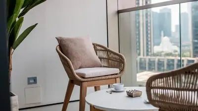 a chair with a pillow on a table in a room at Luxury 1-Bedroom Holiday Apartment in Downtown Dubai I Walk to Dubai Mall and Fountains in Dubai