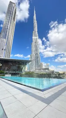 a view of the burj khalifa from the pool in the city at Luxury 1-Bedroom Holiday Apartment in Downtown Dubai I Walk to Dubai Mall and Fountains in Dubai