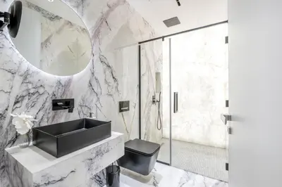 a bathroom with a sink and a mirror at Grand Dubai Marina 4BR Triplex with Pool Gym Sauna in Dubai