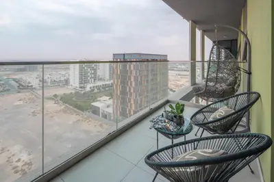 a balcony with chairs and a view of a city at Frank Porter - Pulse C1 in Dubai