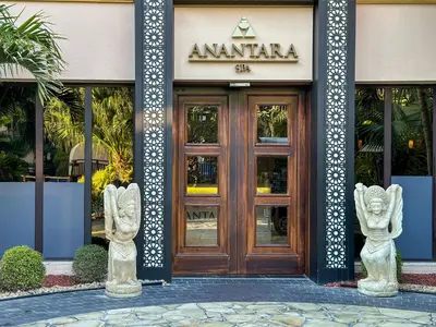 two statues in front of a building with a door at Picture-Perfect 2BR apartment with Burj View in Dubai