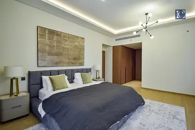 a bedroom with a large bed in a room at Luxury Escapes - Elegant 3 Bedroom plus Maids Room Apartment in JBR in Dubai