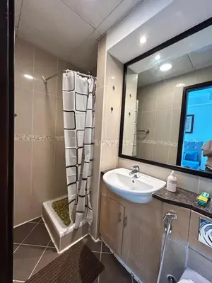 a bathroom with a sink and a mirror at Click Stay - JLT - 2 Bedroom & Balcony Lakes view Entire Apartment -AZ in Dubai