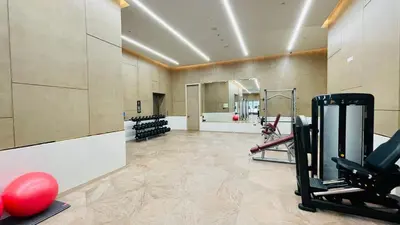 a gym with exercise equipment in a large room at LUX Iconic Views at The Palm Tower Suite 5 in Dubai