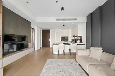 a living room with a couch and a kitchen at Burj Khalifa & Fountain From Your Balcony Near Dubai Mall & Metro in Dubai