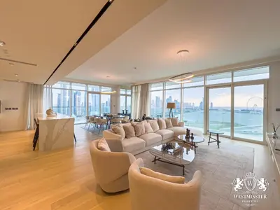 a living room with a couch and a table at Westminster Beach Front in Dubai