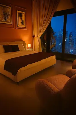 a bedroom with a bed and a window with a view at Luxury Burj Khalifa & Canal View Apartment, Business Bay, Downtown Dubai in Dubai