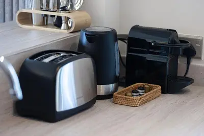 a kitchen with a coffee maker and a toaster at Mahogany 1 - 2BR 6 PAX - Amazing Oasis - 1500 sqft in Dubai