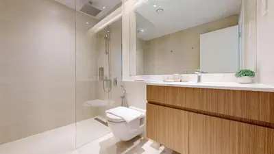 a bathroom with a toilet and a sink and a shower at La Sirene 3 - Elegant Two Bedroom in Jumeirah 1 in Dubai