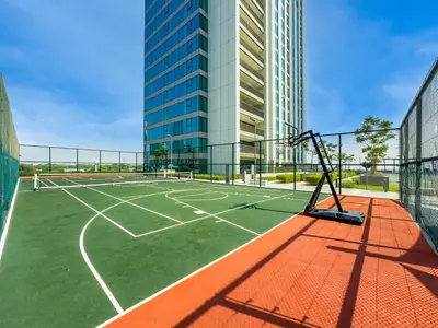 a tennis court in a city with a building at The Cinema Suite Luxury 2-Bed Near Dubai Mall in Dubai
