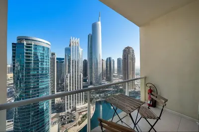 a balcony with a view of a city skyline at Stunning Lake View Apartment in JLT in Dubai
