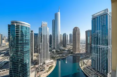a view of a city with tall buildings and a river at Stunning Lake View Apartment in JLT in Dubai