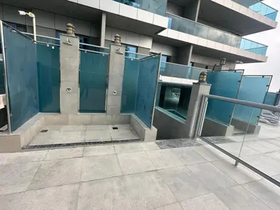 an outside view of a building with blue doors at Elite Residence business bay Downtown Dubai in Dubai
