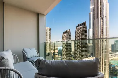 a balcony with a view of a city skyline at Unit Overlooking Burj Khalifa and Fountain View in Dubai