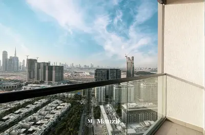 a view of a city from an office building at 1BR Apartment in Sobha Hartland with Skyline Views in Dubai