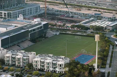 an aerial view of a tennis court in a city at 1BR Apartment in Sobha Hartland with Skyline Views in Dubai