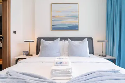 a hotel room with a bed with a sign on it at Sky-High Serenity - Stylish 1BHK - 20th Floor in Dubai