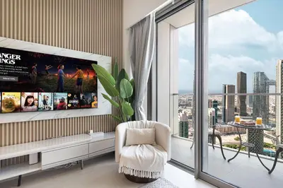 a living room with a view of a city at GRANDE SIGNATURE- 2BR Apartment with full Burj Khalifa views in Dubai