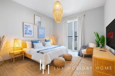 a bedroom with a bed and a living room at LUX The La Mer Infinity View - Luxury Boho Suite 1 in Dubai