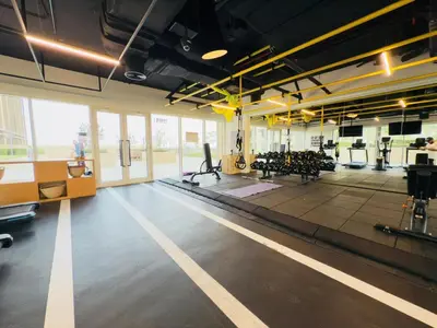 a gym with a lot of treadmills and machines at Luxe Escape at Dubai Hills in Dubai