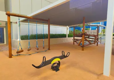 a playground with swings and a swing at HiGuests - Vibrant 1BR in Business Bay in Dubai
