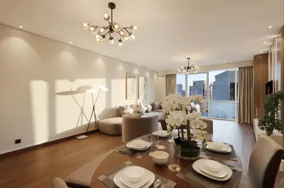a living room with a dining table and a couch at Livbnb-2B Stunner with Iconic Ain Dubai View in Dubai