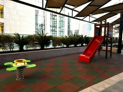 a playground in a building with a red slide at Downtown 1BR - 5 minutes to mall - panoramic pool in Dubai