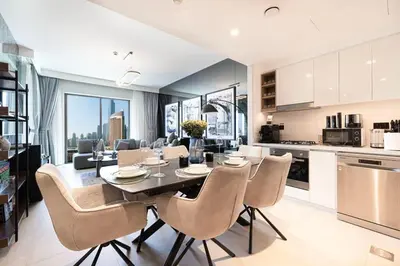 a kitchen and dining room with a table and chairs at Luxury 2BR Burj Khalifa View Dubai Mall in Dubai