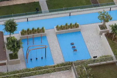 an overhead view of a large swimming pool at Luxury 2BR Burj Khalifa View Dubai Mall in Dubai