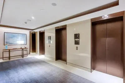 a large hallway with a door and a table at FIRST CLASS 3BR Burj Khalifa & Fountain View in Dubai