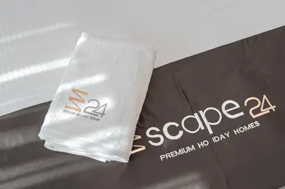 a bag of paper sitting on top of a table at Escape24 Modern 1BR with Pool View in JVC in Dubai