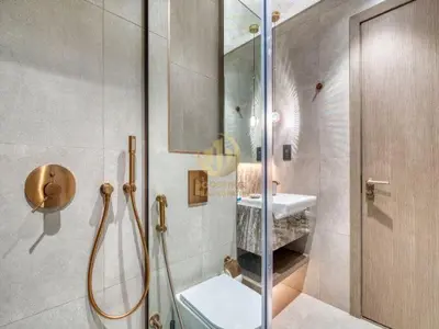 a bathroom with a shower and a toilet and a sink at Luxury 1BR Larger Layout Westwood Grande - 1103 in Dubai